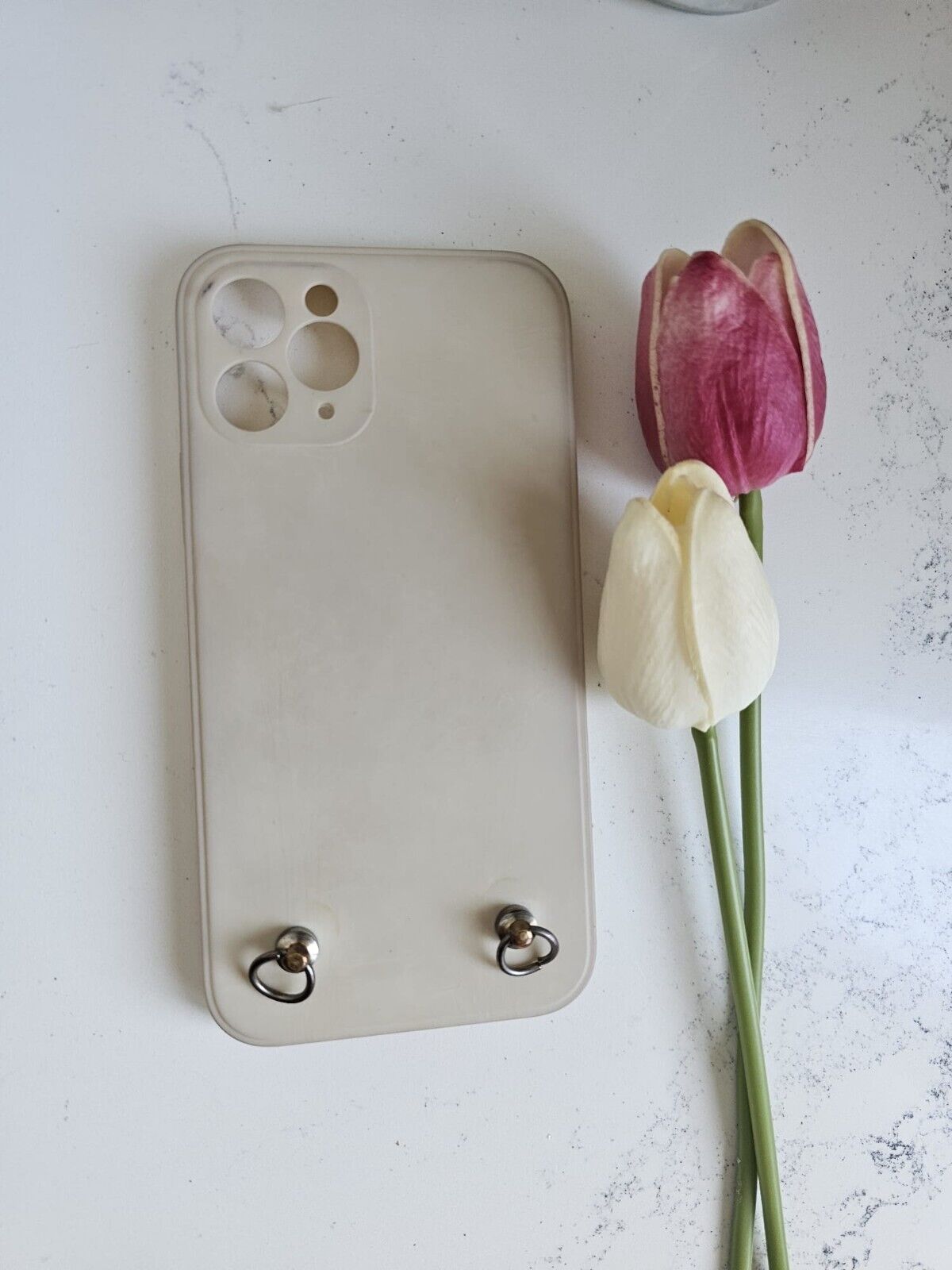 Apple phone cover  with rings suitable for a chain to hang