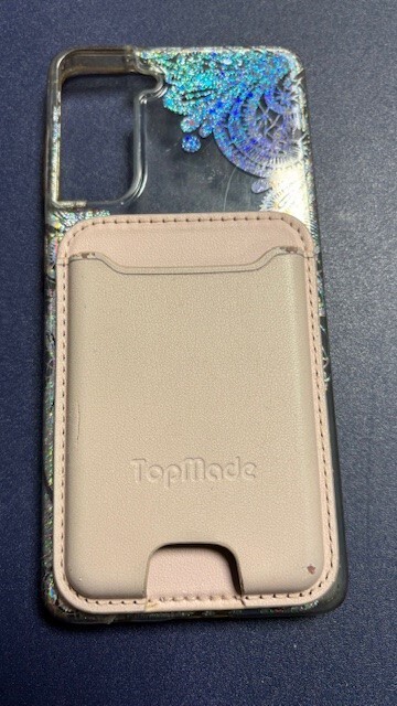 woman’s apple phone case with integral Top Mode credit card holder